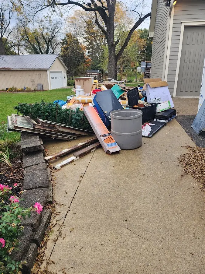Dumpster being loaded with debris for Estate Cleanout Dumpster Rental in Dixon Lane-MeadowCreek